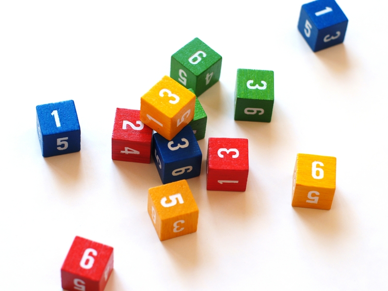 A scatter of coloured dice